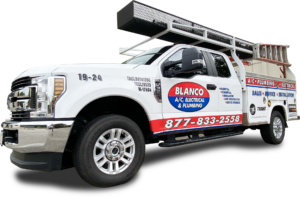 white truck with ladder, tools and blanco ac, electrical & plumbing branding