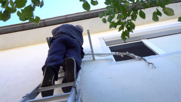 hvac tech working on wiring on outdoor unit