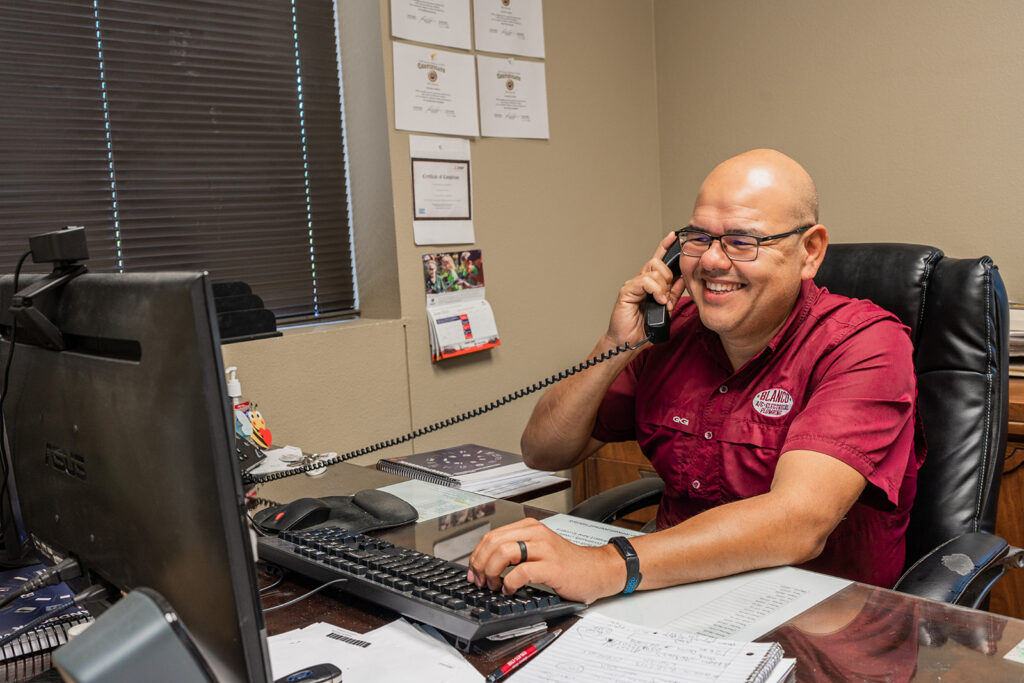 Blanco customer service representative smiling and talking on the phone